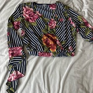 XS floral long sleeve w/ deep V cut & wide arm cuff details (cropped)